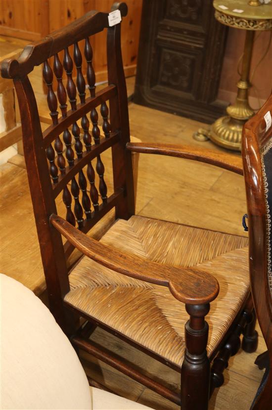 An early 19th century oak spindle back chair